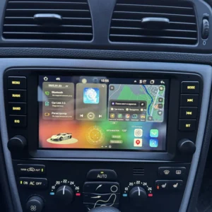 Car dashboard with a large touchscreen displaying navigation map and widgets, climate controls below the screen.