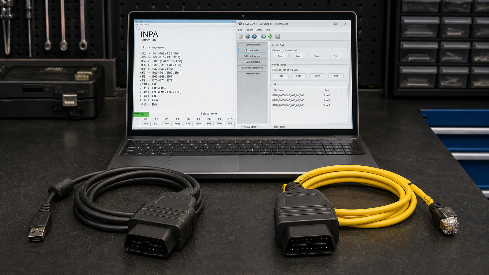kdcan-enet-bmw-diagnostic-cable-guide - speedXperts Two BMW diagnostic cables side by side on a workshop bench next to a laptop showing BMW diagnostic software