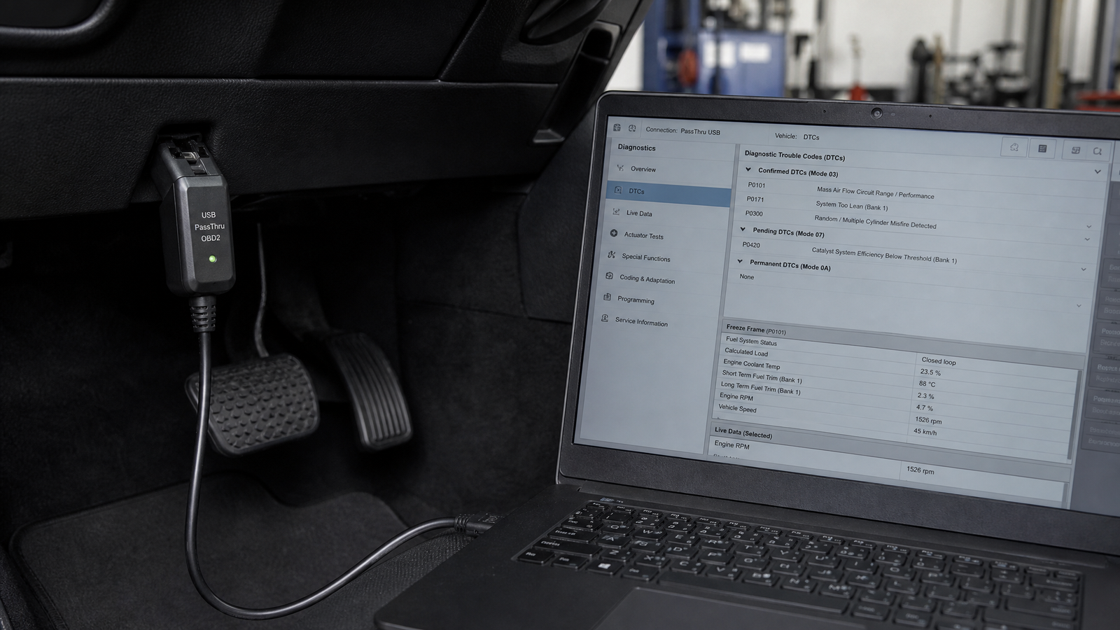openport-2-0-passthru-xentry-techstream-guide-1 - speedXperts OpenPort 2.0 PassThru interface connected to OBD port and laptop showing diagnostic software in workshop